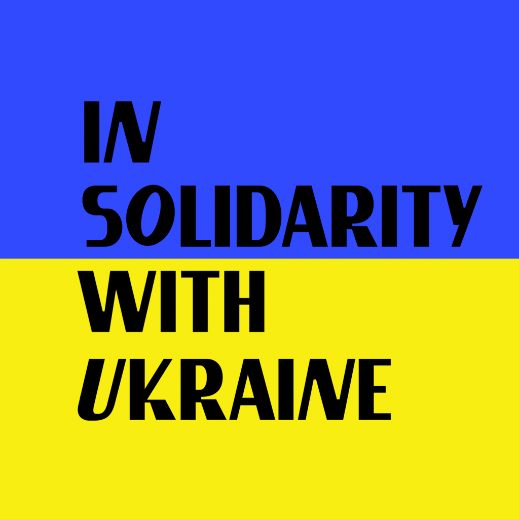 blue and yelow graphic with black letters – in solidarity with ukraine