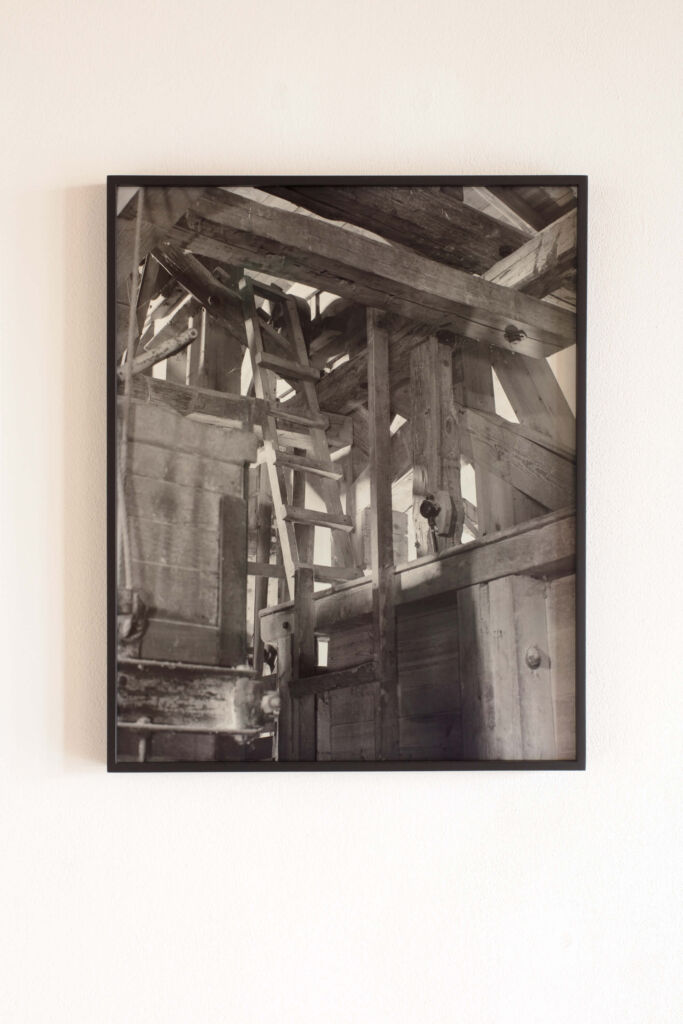 A black and white photograph of a wooden structure.