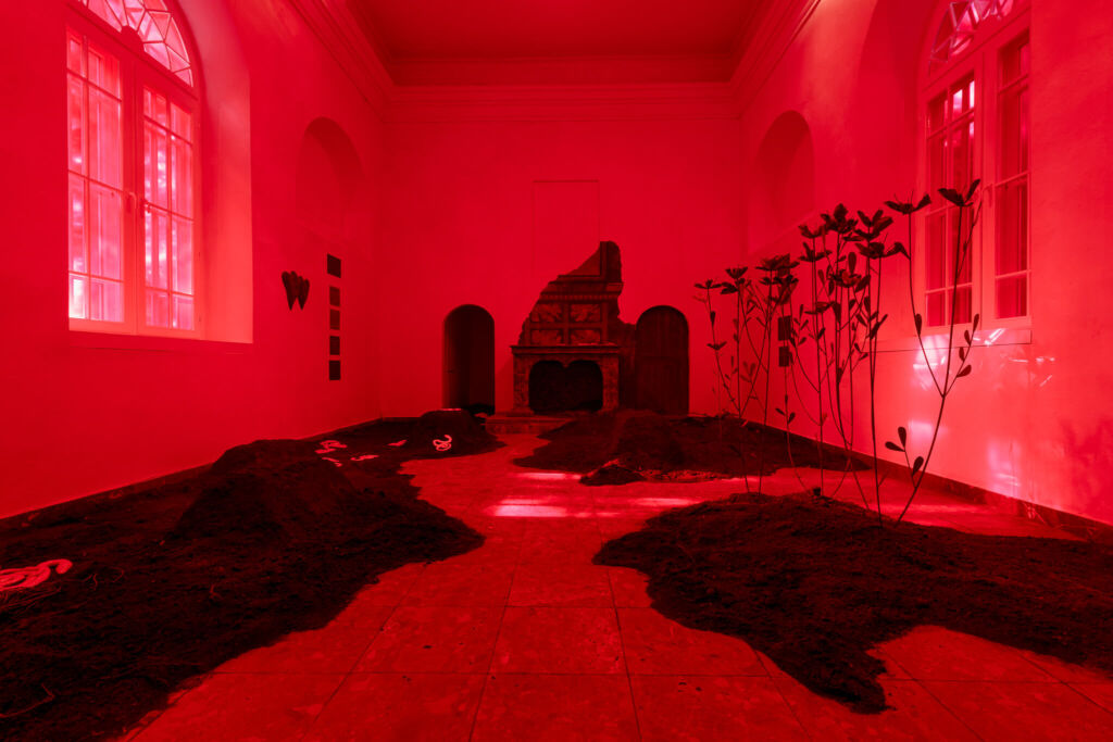 A room with red lights and a red floor.